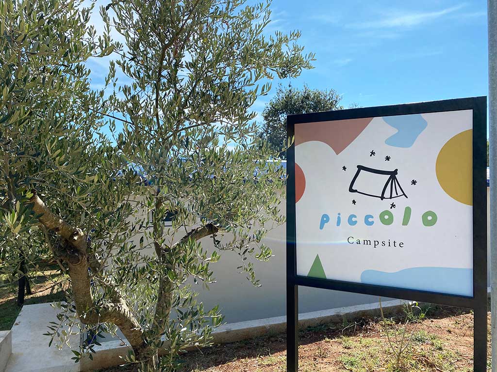 Entrance sign at campsite Piccolo